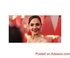 Gal Gadot's Yellow Feathered Dress Is the Perfect Look for Her New Spy Movie